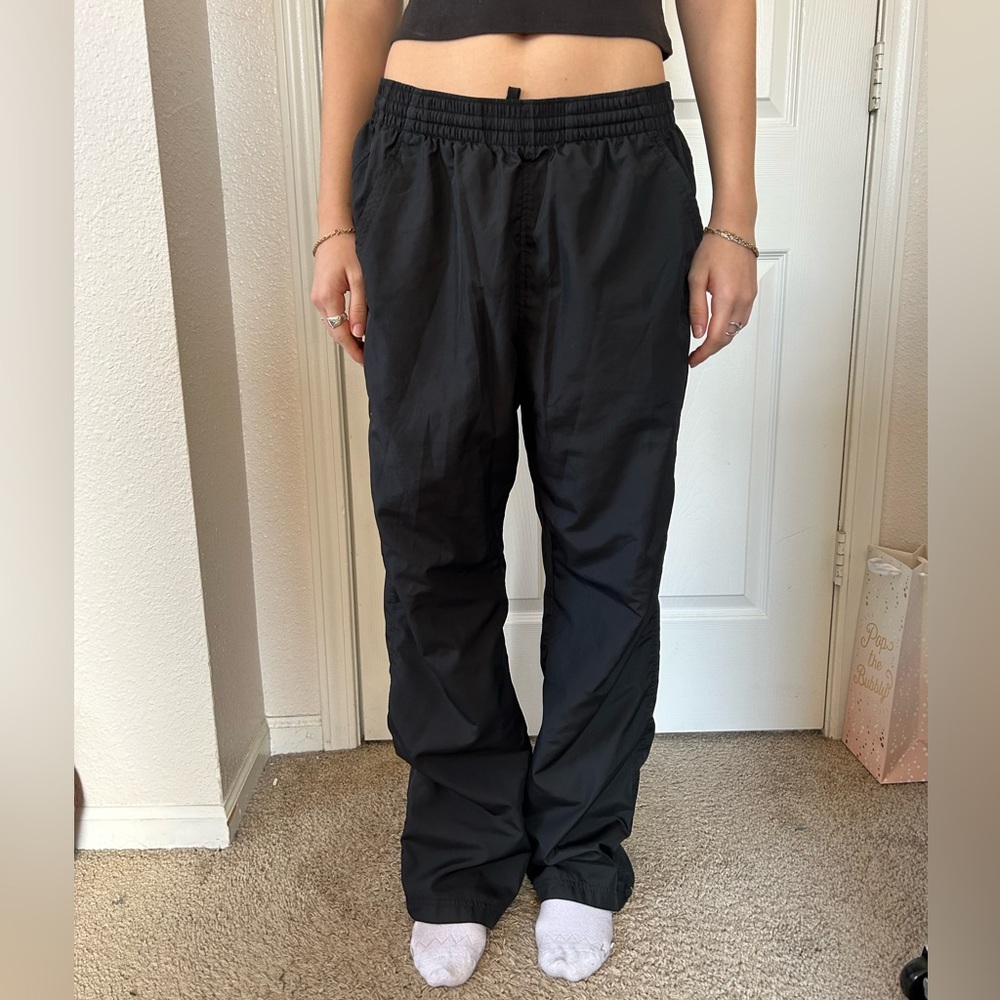 black nylon Under Armor track pants
